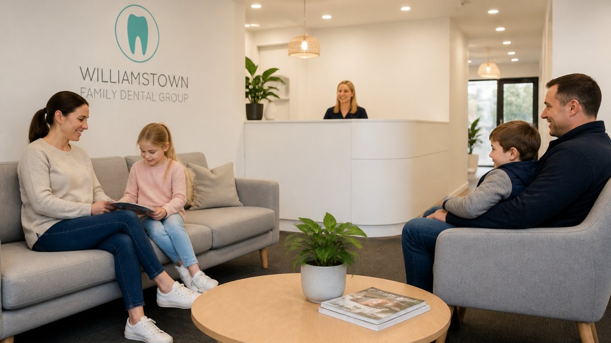 Relaxed families waiting in a welcoming family dental clinic health fund reception area with soft lighting.