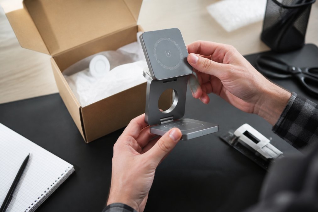 Close-up of hands carefully unboxing tech accessories, examining product quality and packaging materials with attention to detail, inspecting connector compatibility