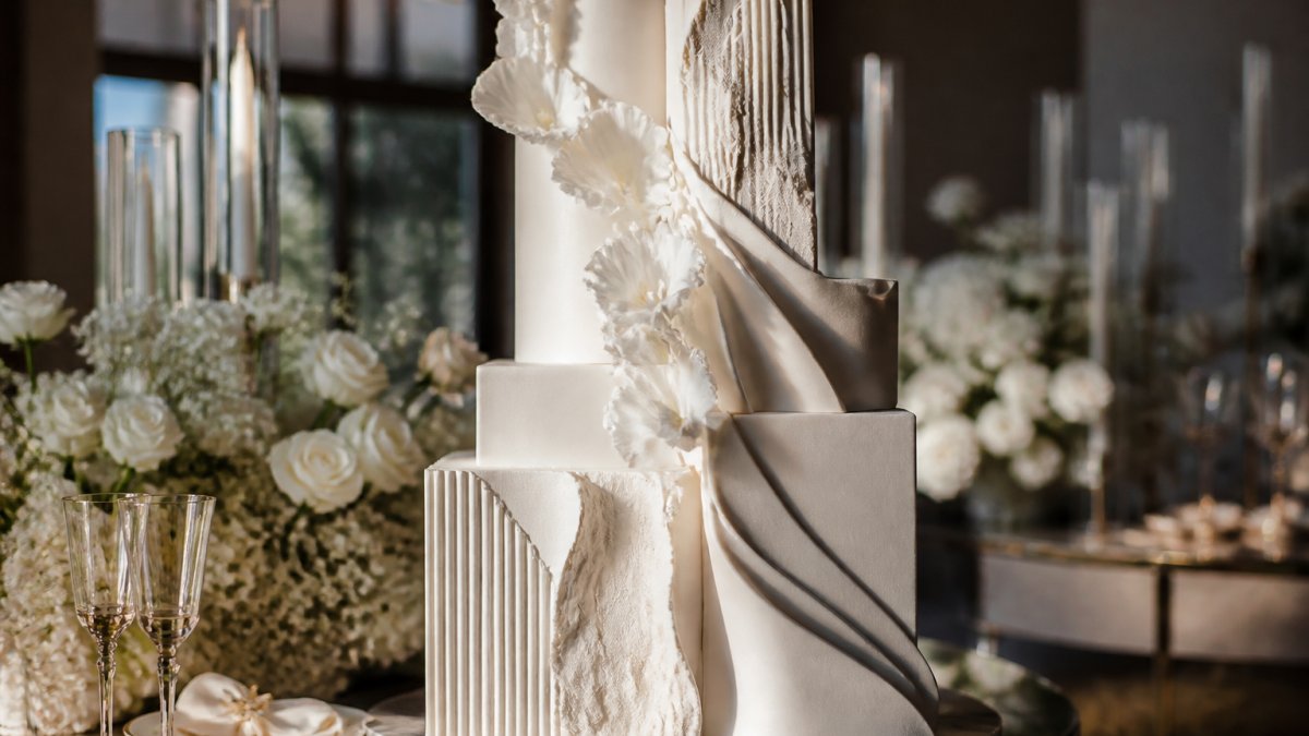 Infographic illustrating the structural engineering process behind a fine art cake design with architectural tiers