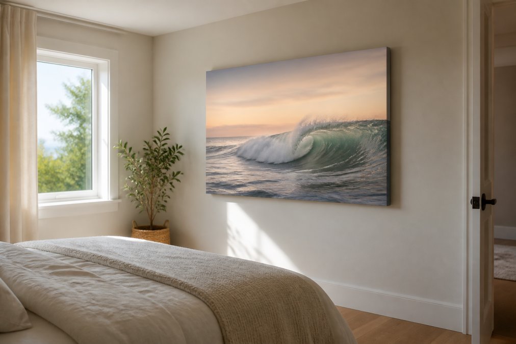 Minimalist bedroom featuring an unframed, gallery-wrapped landscape canvas print on a feature wall, demonstrating the dimensional, floating effect with soft morning light