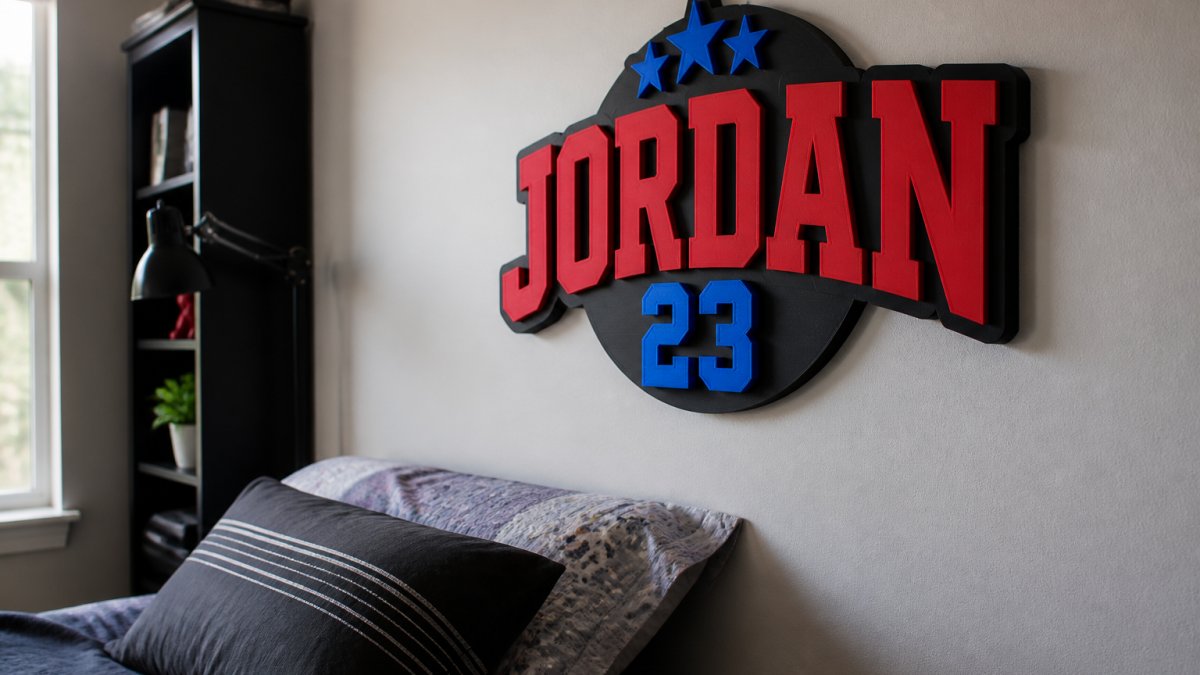 Vibrant dimensional lettering with layered texture mounted on a bedroom wall in natural light