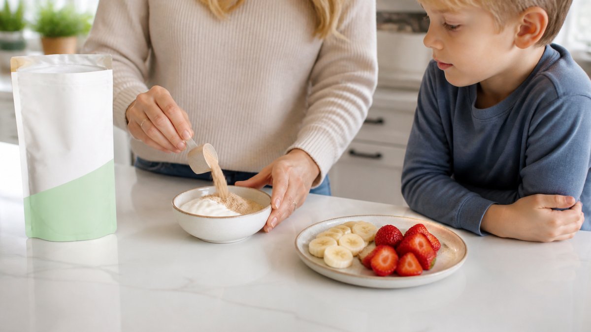 Parent stirring nutritional powder into a bowl of yogurt for a child
