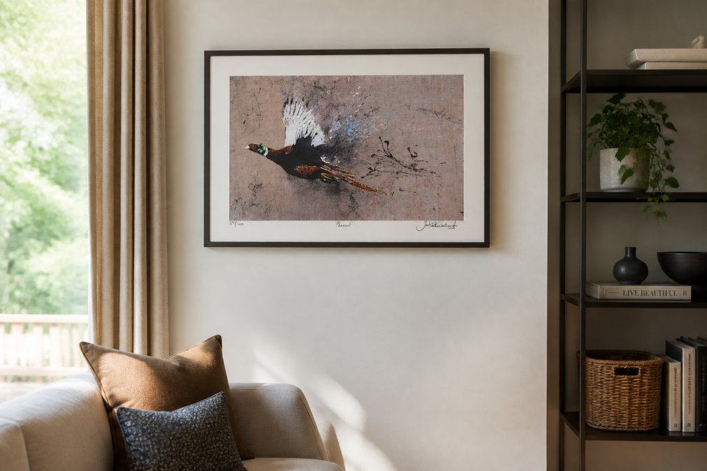 A framed limited edition wildlife print displayed on a modern living room wall, showing the signature and numbering details clearly visible in the lower margin, with natural daylight illuminating the frame