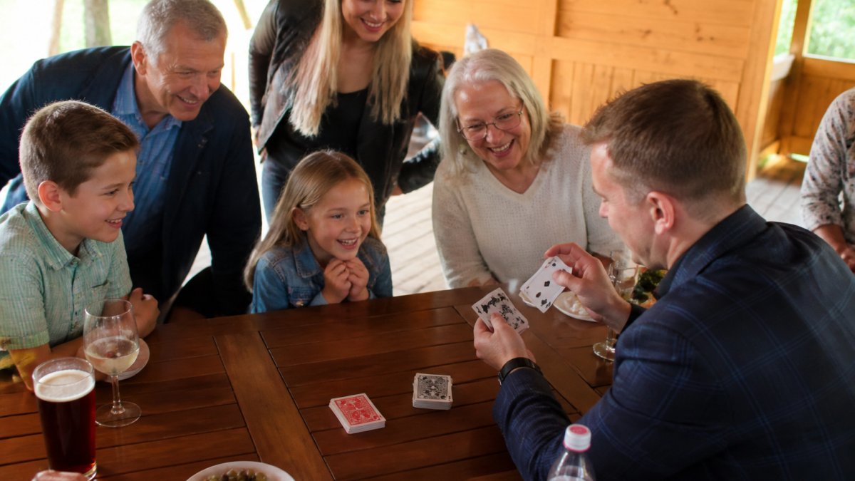 Infographic showing how hiring a magician engages family members of all ages with close-up magic tricks