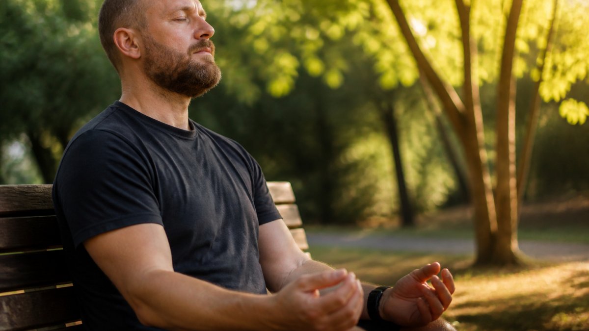 Veteran practicing mindfulness in a park as part of holistic therapy for combat ptsd to build nervous system resilience.