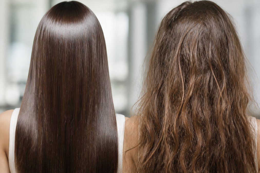 Close-up of smooth, shiny hair strands with aligned cuticles reflecting light, contrasted with frizzy, damaged hair texture showing raised cuticles