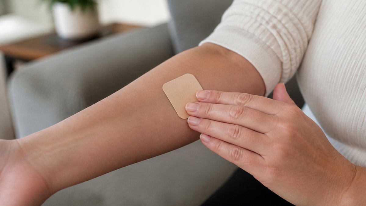 Step-by-step guide on how to apply a CBD patch to take to work by pressing it firmly onto clean inner forearm skin.