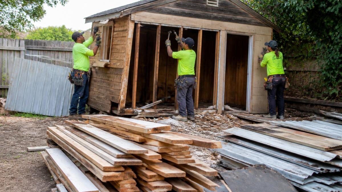 Infographic showing how material sorting and labor affect shed demolition cost during a workspace teardown.