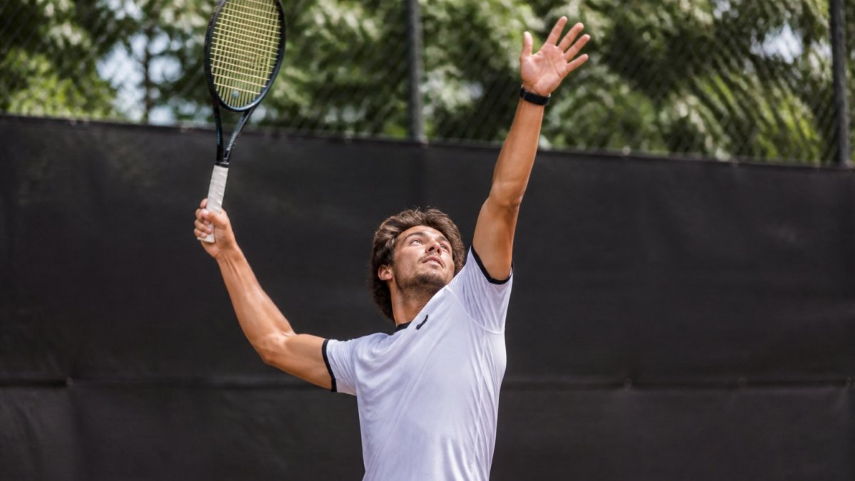 Diagram illustrating wrist snap and pronation to add spin tennis serve through the contact point