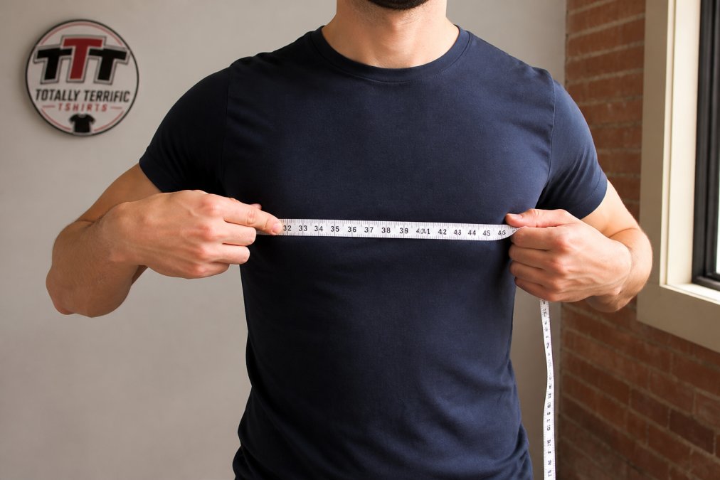 Diagram showing how to measure your chest at the fullest point to choose accurate t-shirt sizes.