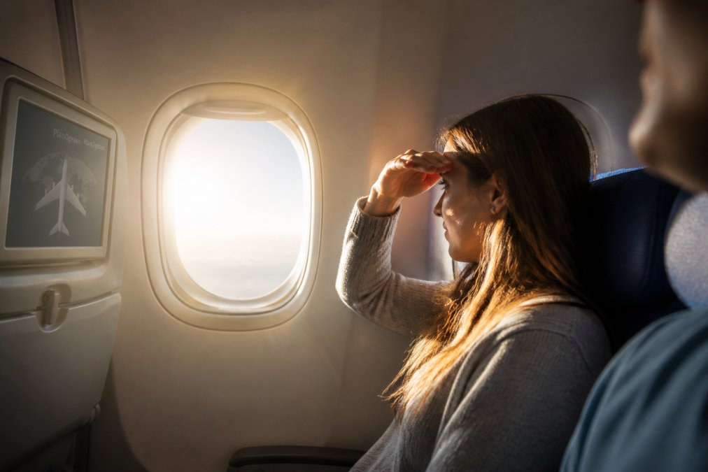 Professional illustration showing window and passenger and seated concepts for best window seat