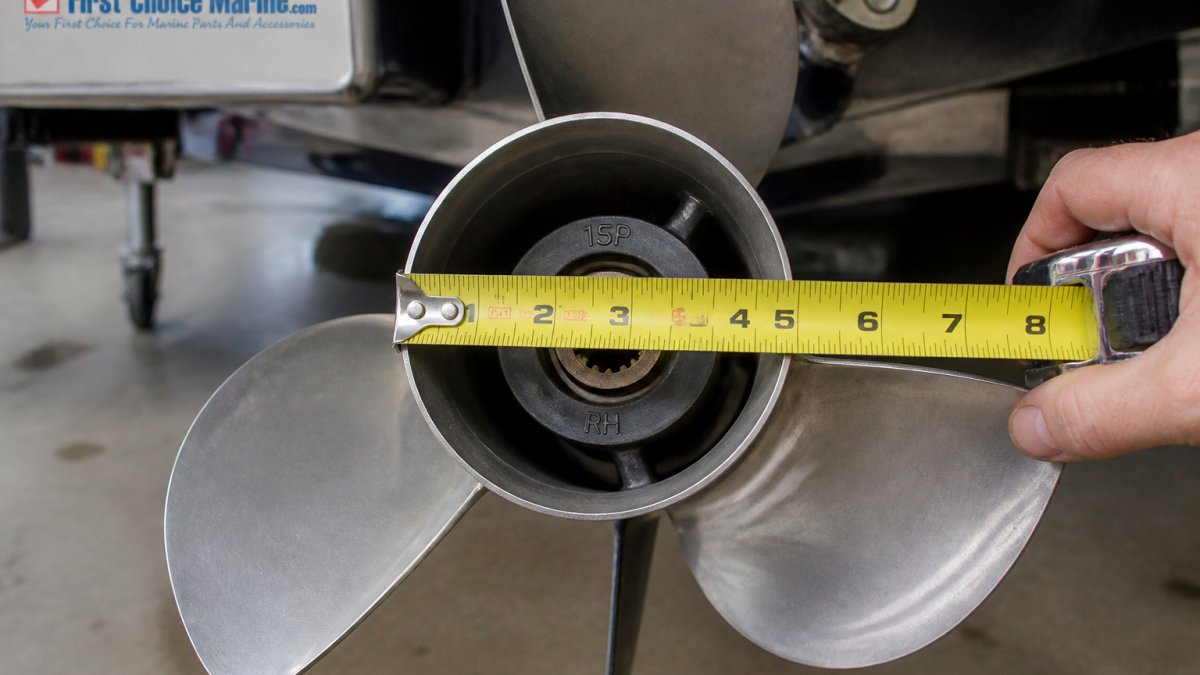 Diagram demonstrating how to measure boat propeller diameter and pitch using a tape measure