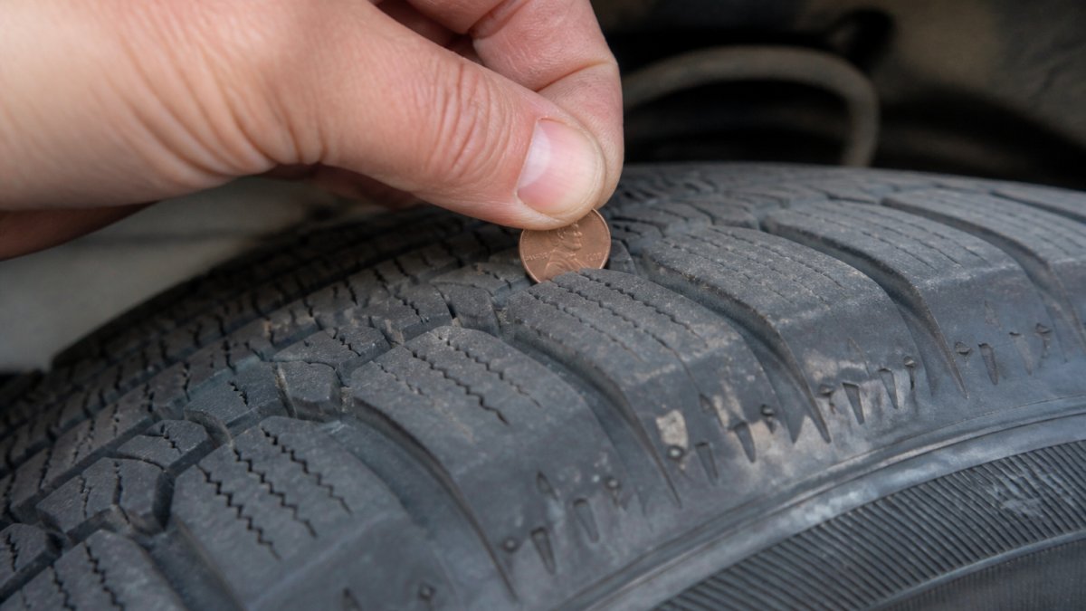 Infographic showing how to choose tires for Idaho winters by using a penny to check tread depth and wear indicators.