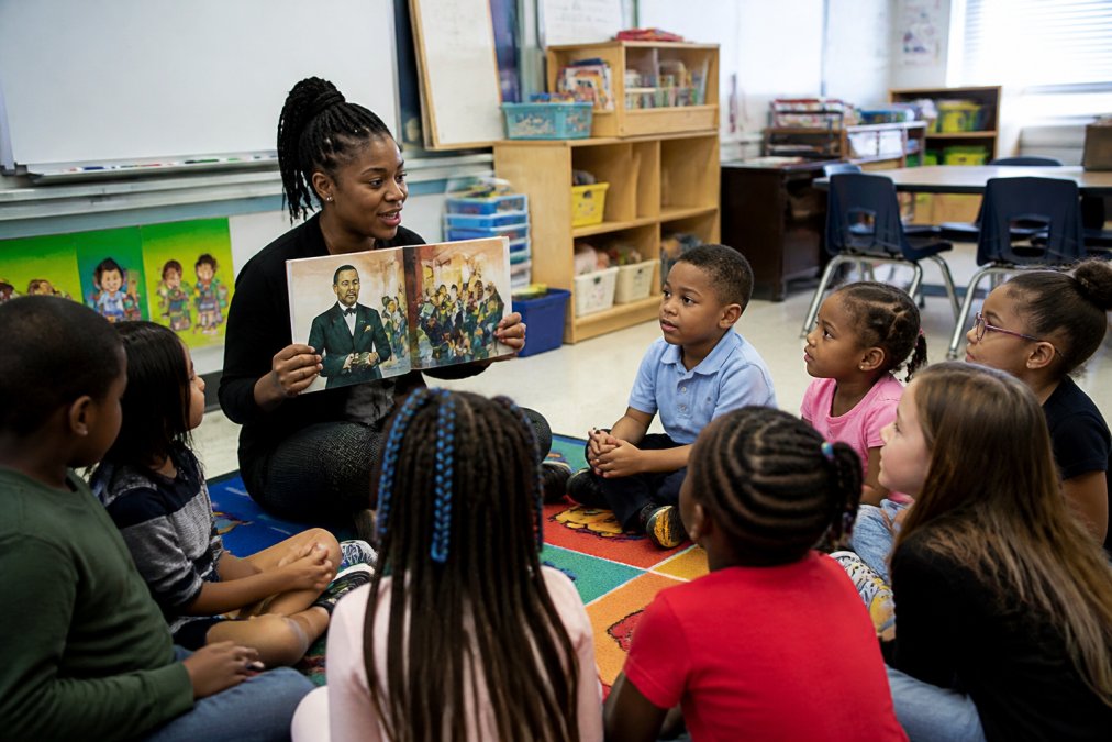Diverse elementary students in a circle engaging in a hands-on activity as part of how to create Black History Month 2026
