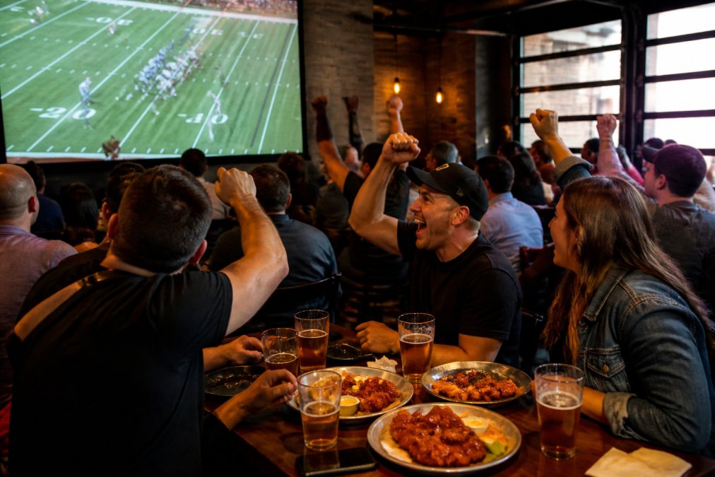 Infographic showing how to time your visit to capture the best game day specials at a lively sports bar.