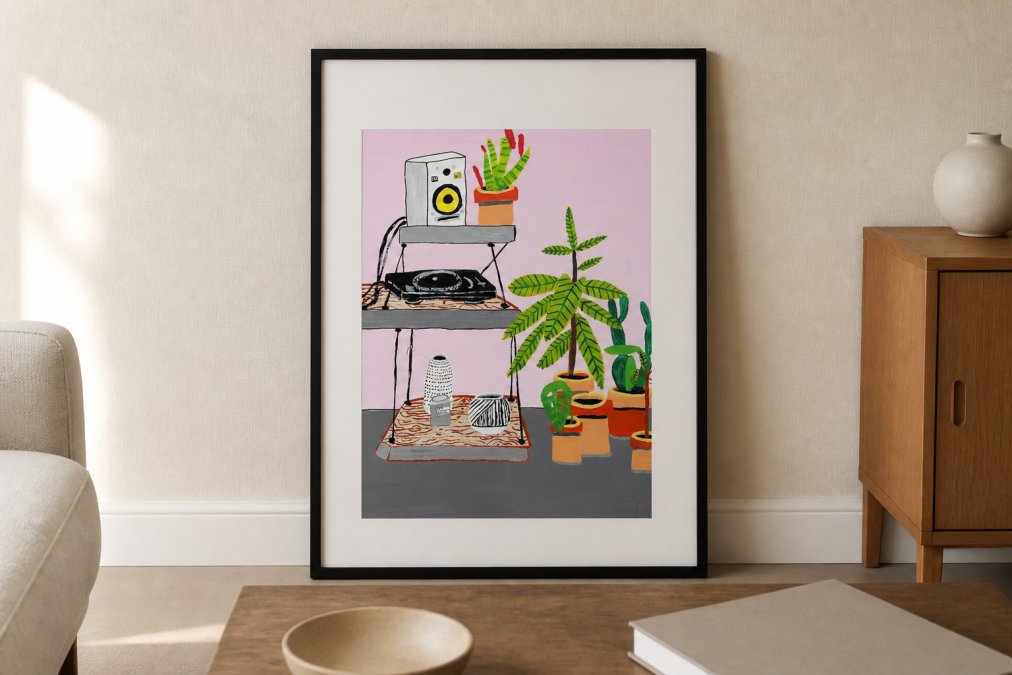 A framed contemporary art print with a wide white mat and thin black frame leaning against a pale linen-colored wall in a minimal, well-lit living room, soft afternoon light coming from the left, a low wooden bench in the foreground