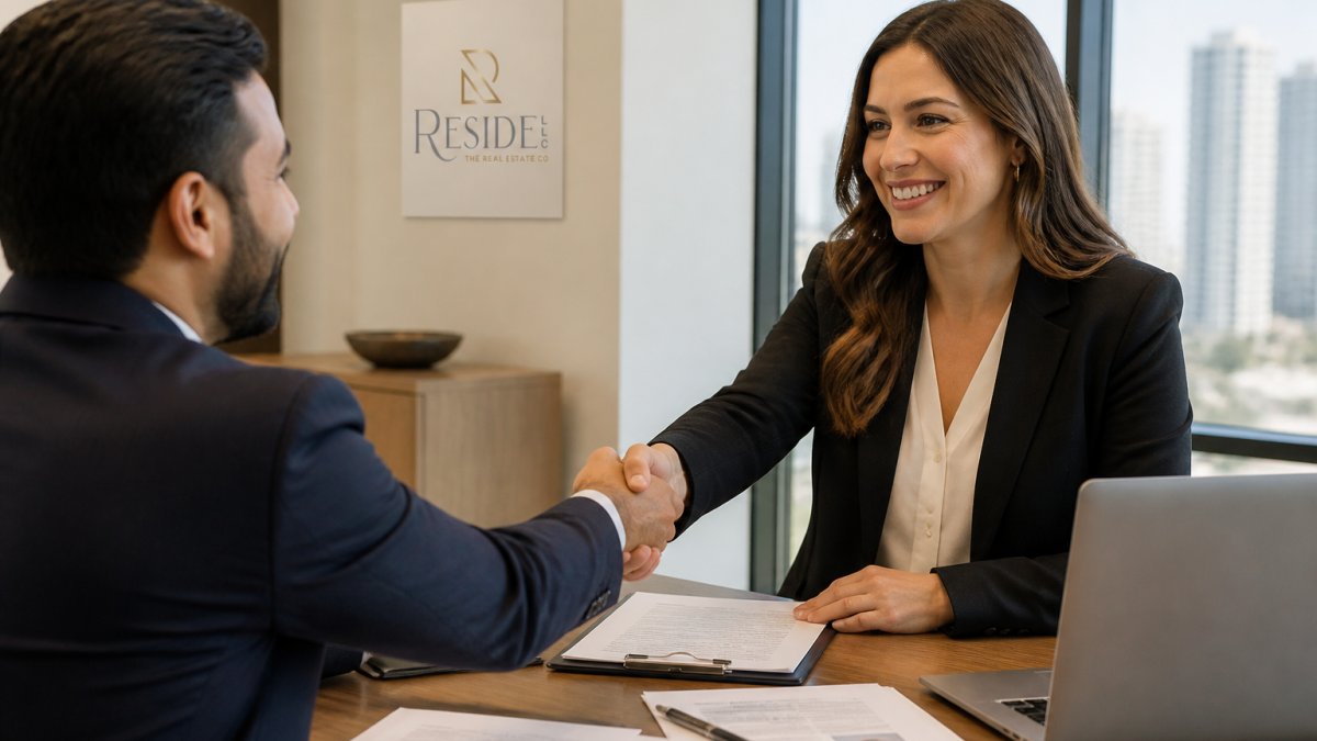 Real estate consultant shaking hands with a client to hire real estate consultant in a modern office