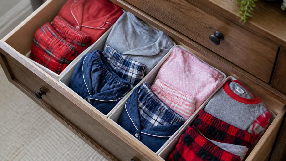 Diagram illustrating how to group matching pajama sets in dresser drawers using fabric dividers and organizers.