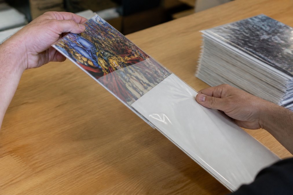 Step-by-step guide showing how to organize comic book collections by bagging and boarding with archival supplies.