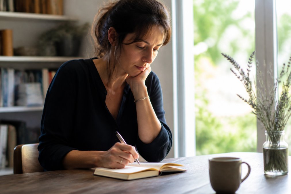 Taking notes in a journal can help overcome self-limiting beliefs through personal reflection