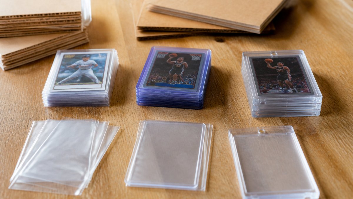 Trading cards in penny sleeves, top loaders, and card savers to safely ship trading cards on a flat surface.