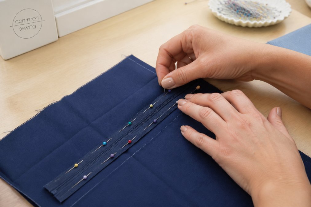 Diagram showing how to pin and align fabric to sew a zipper into a skirt with tailor's chalk markings.