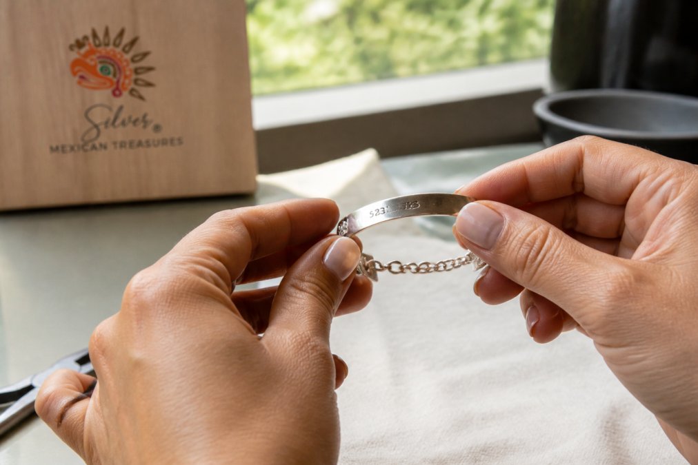Infographic steps to verify artisan fair trade jewelry by checking sterling silver hallmark stamps and polish.