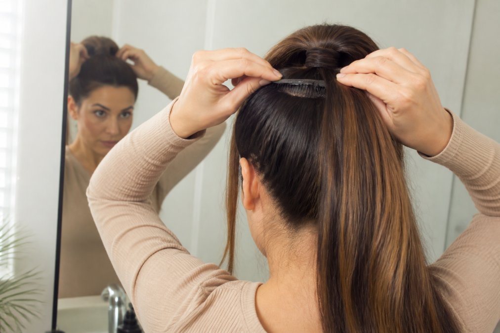 Step-by-step diagram showing how to attach high ponytail extensions to natural hair for a seamless finish