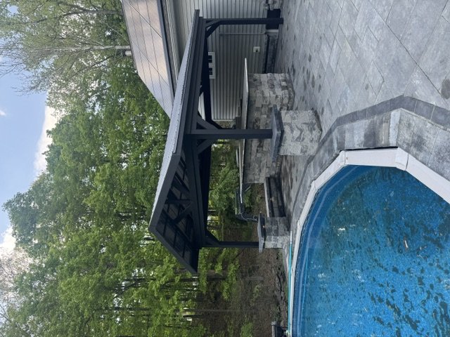 covered outdoor patio with pool