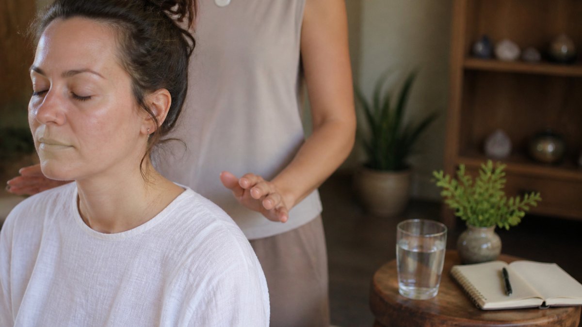 Step-by-step process for tracking energy work sessions with a practitioner in a calm studio setting
