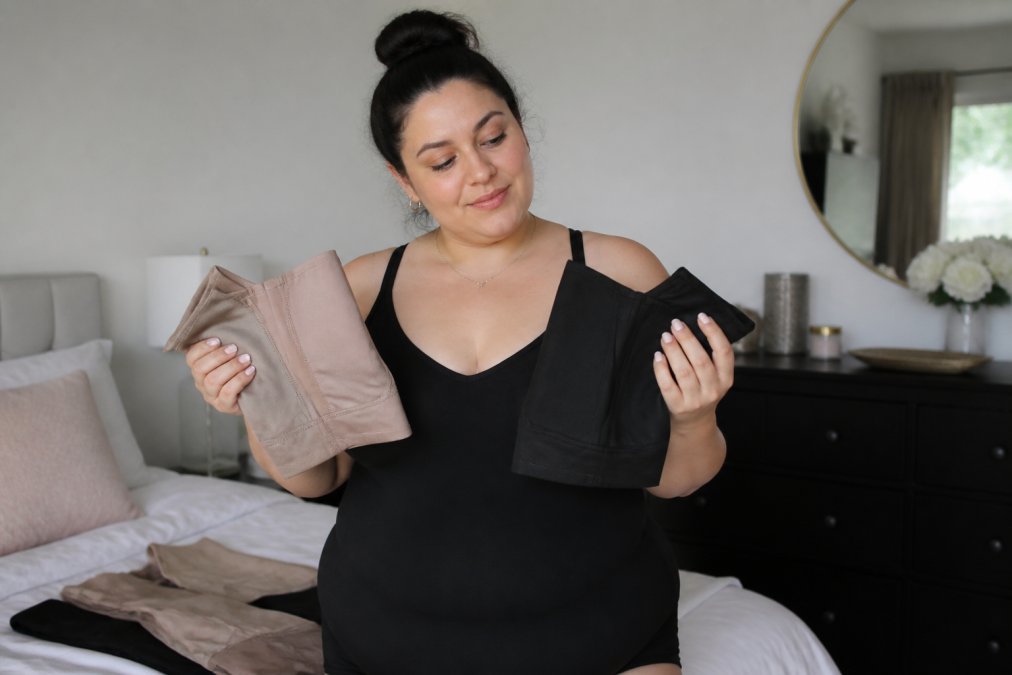 Infographic comparing fabric weight and stretch levels for expensive shapewear bodysuits held by a woman