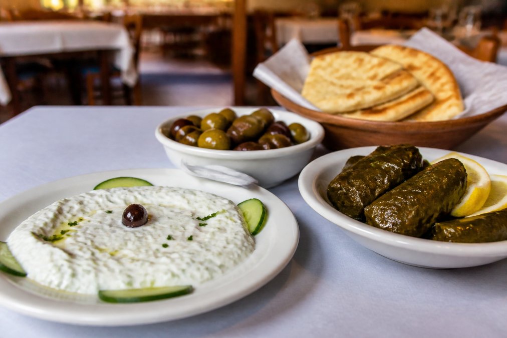 Infographic showing essential Greek mezze dishes to help you decide if is greek food worth the price