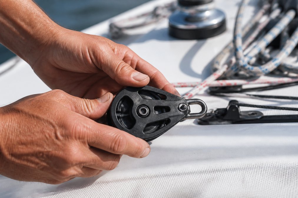 Diagram highlighting the durability of Harken deck hardware via a close-up inspection of a 45mm block component.