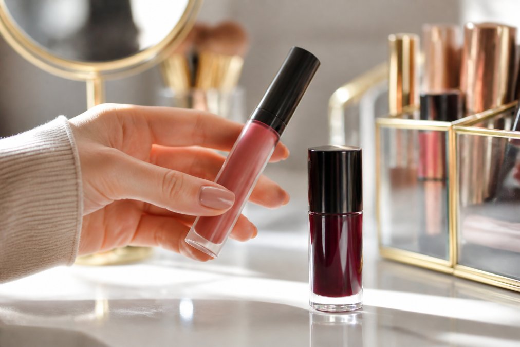 Matte liquid lipstick and lip stain bottles on a vanity for long-lasting lip color application.