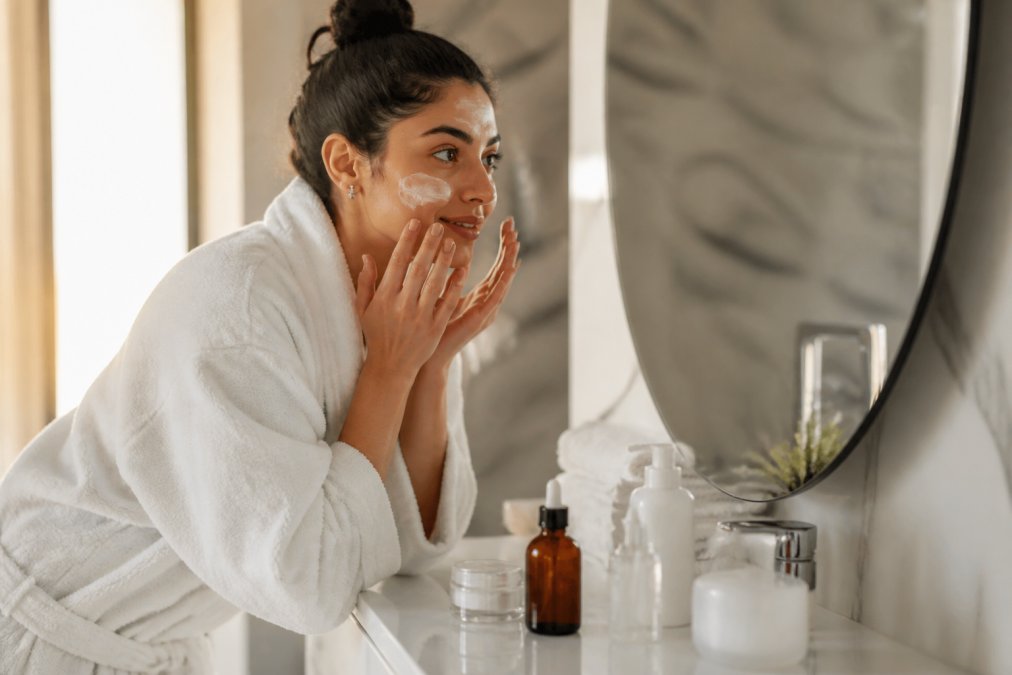 Skincare bottles arranged on a bathroom counter for a jordan wellness routine under soft natural light