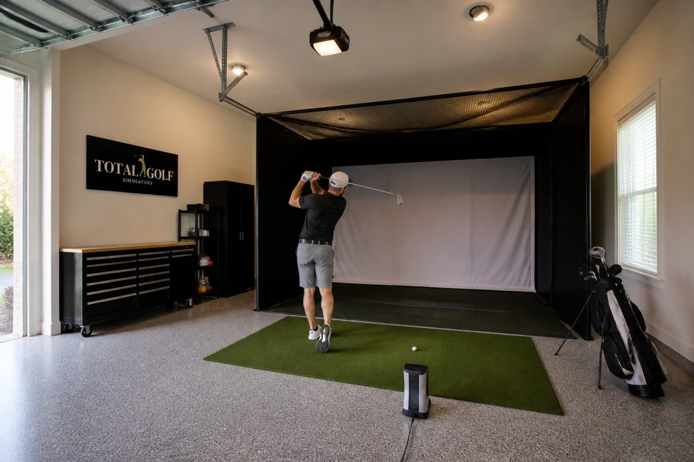 Diagram showing ideal garage golf simulator dimensions and the correct placement for a floor-based launch monitor.