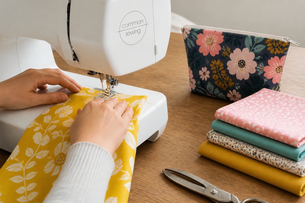 Step-by-step process to sew handmade gifts, showing a zipper pouch being assembled on a sewing machine.