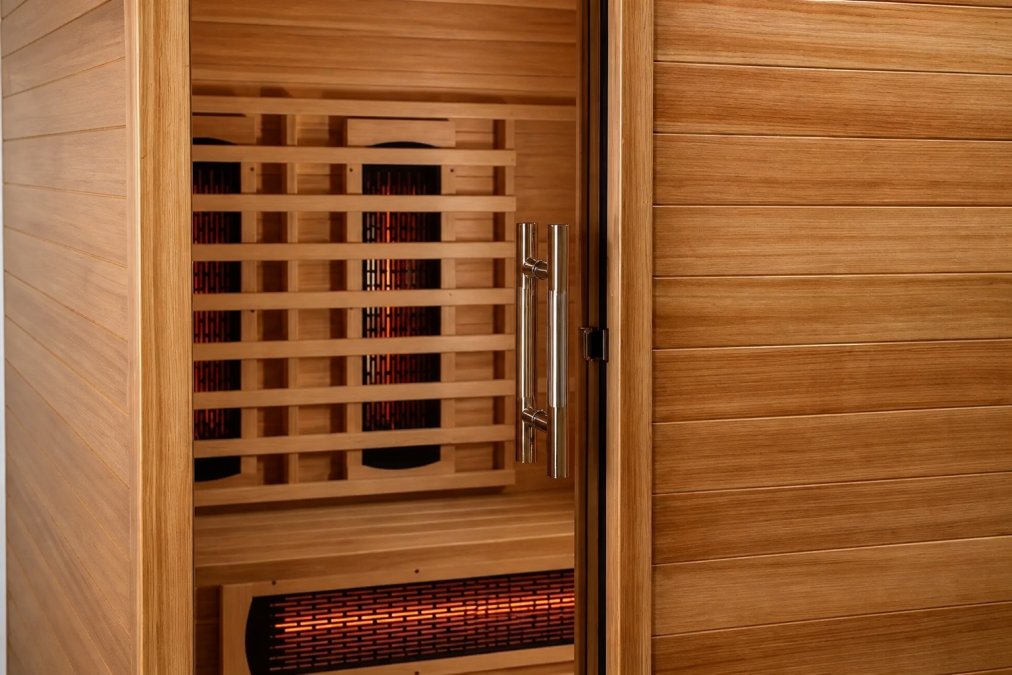 Close-up detail of premium Canadian cedar and hemlock wood grain textures, showing natural wood character, rich color variations, and fine craftsmanship visible in joinery and construction