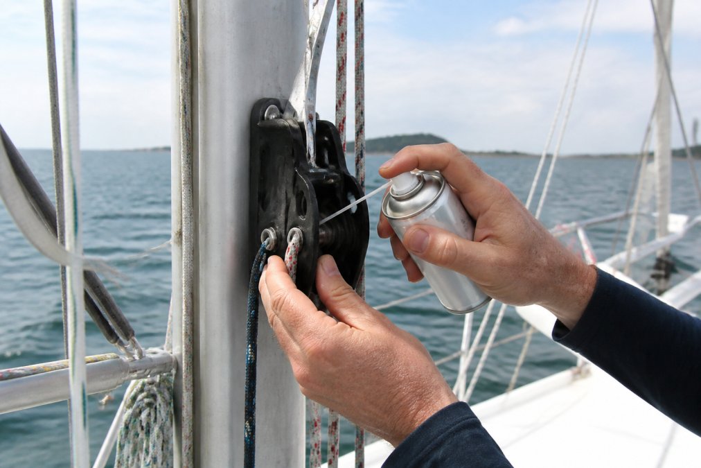 Professional illustration showing sailor's and hands and applying concepts for maintaining sailboat blocks and lines