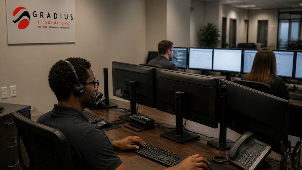 Security operations center team monitoring multiple screens displaying network activity and threat alerts in a modern control room environment
