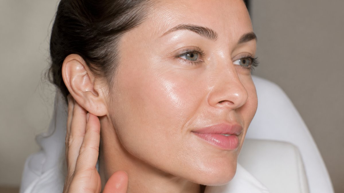 Close-up of person's face showing smooth, radiant skin with refined texture and even complexion, demonstrating visible results from professional skin revitalization treatment
