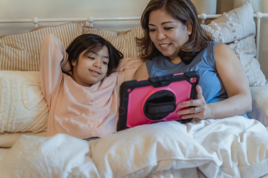 Parent with a child an AAC device