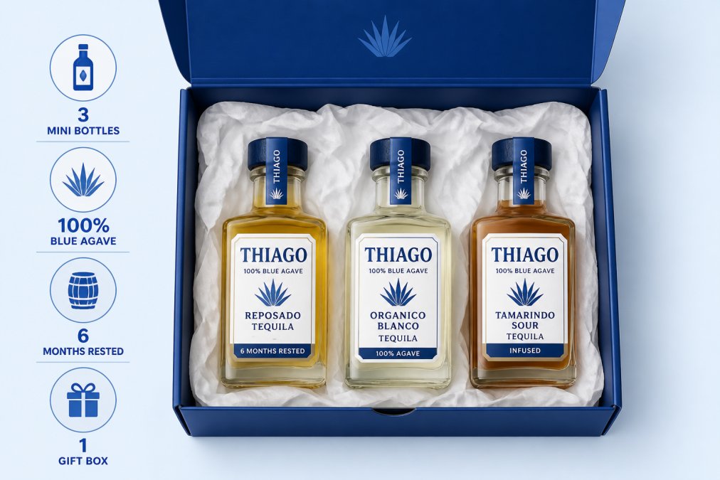 Premium tequila mini bottles arranged in an elegant gift box with white tissue paper, photographed from directly above on a neutral cream background, showing the label details clearly