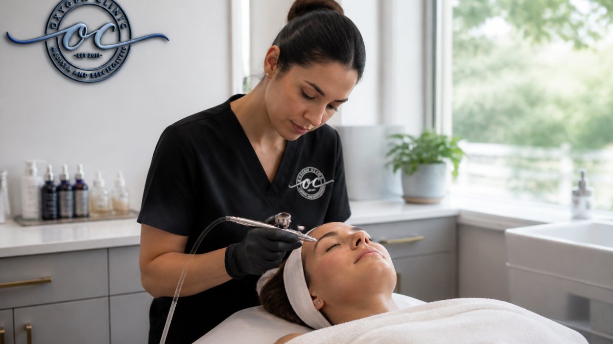 Professional demonstrating oxygen facial treatment technique in modern clinical setting with natural lighting