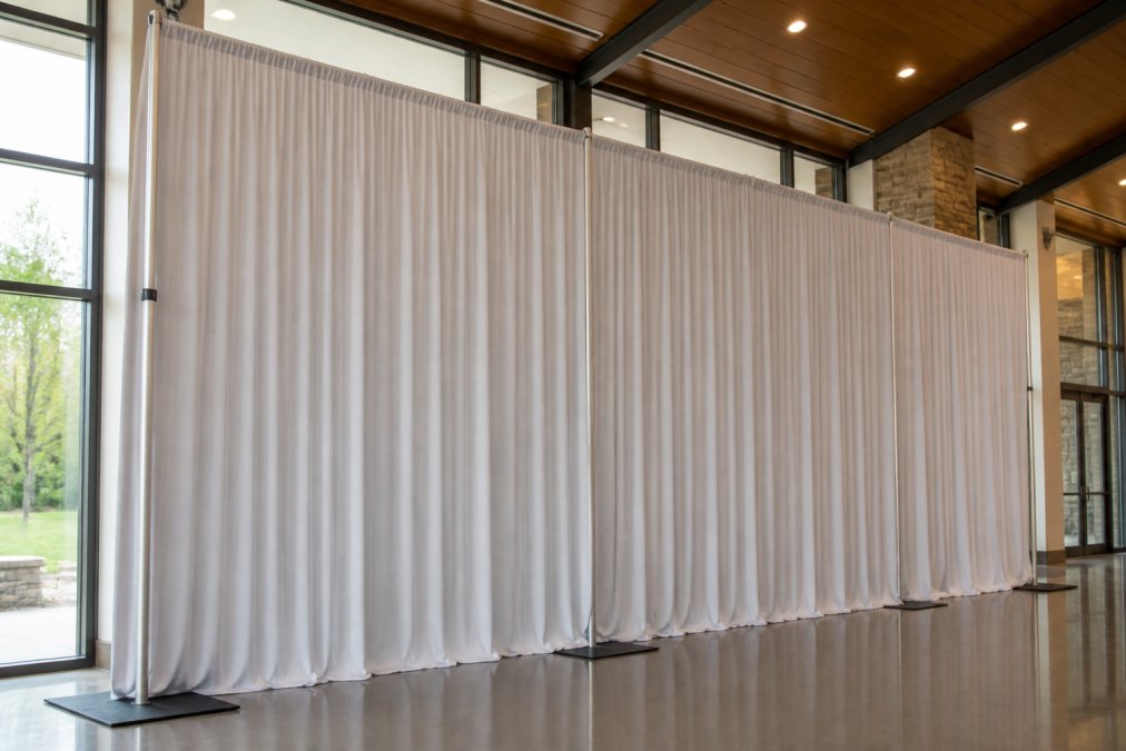 Professional illustration showing pipe and drape backdrop rental cost