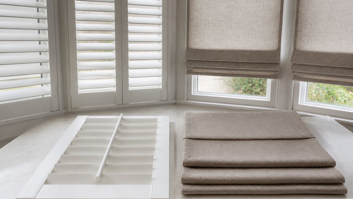 Plantation Shutters vs Roman Shades for Bays