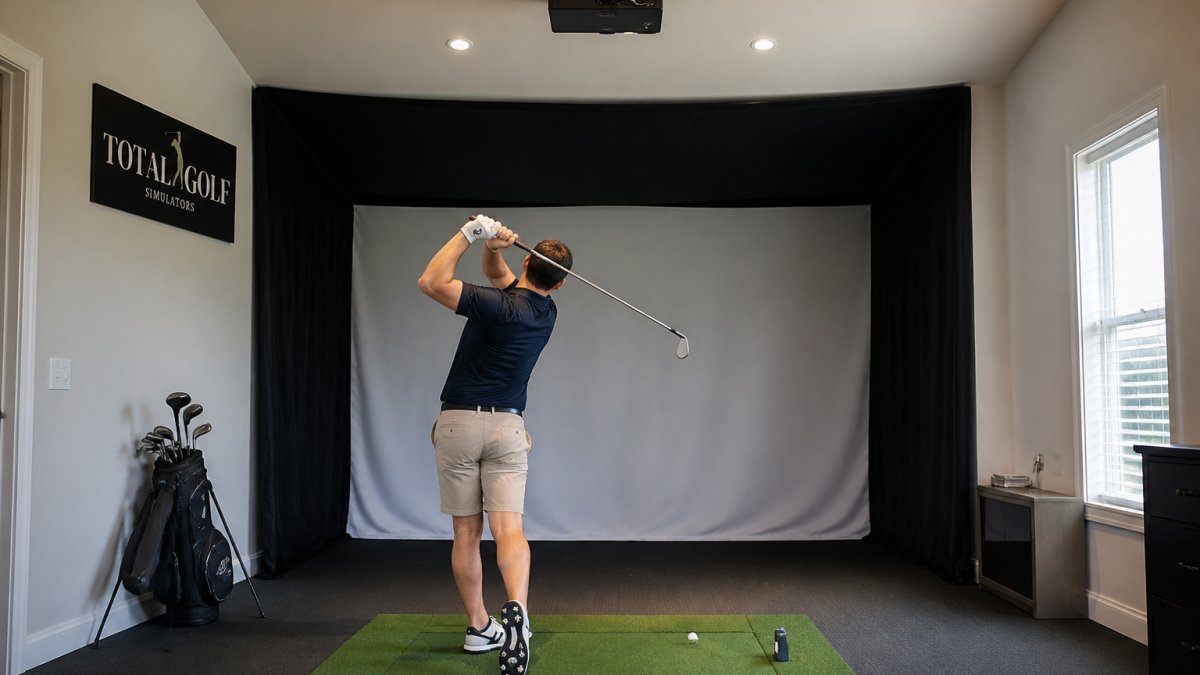 Diagram showing recommended room dimensions and equipment layout for a home golf simulator setup