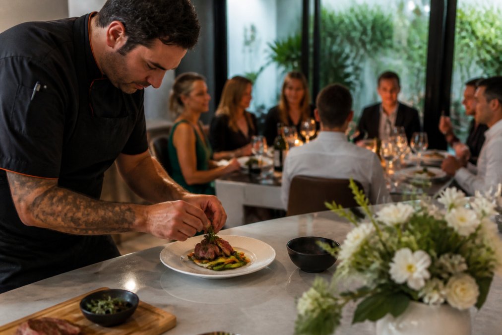 Visual comparison chart showing Sydney for private chef vs restaurant dining cost