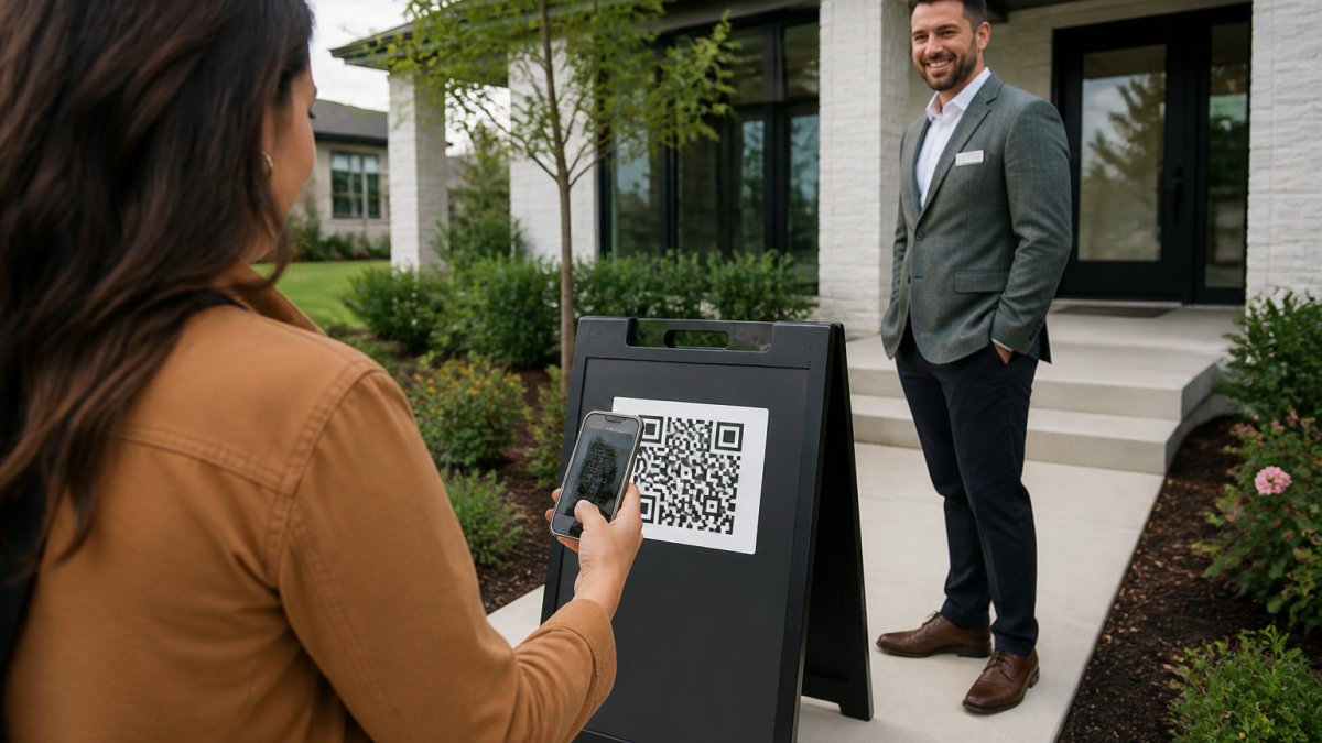 Professional real estate agent standing outside a modern home next to an a-frame sign displaying a QR code, with a prospective buyer's hand holding a smartphone scanning the code