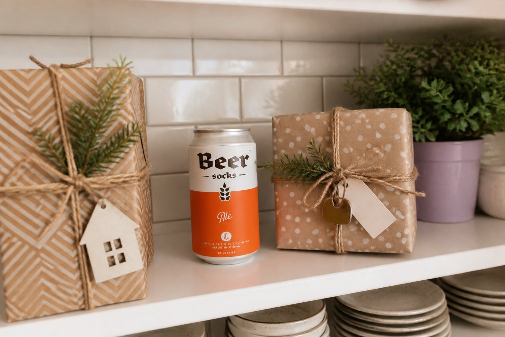 Thoughtfully wrapped gift boxes and home decor items styled on a bright kitchen shelf, showing how quirky presents enhance a new living space
